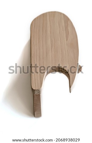 A wooden block made of beech for ironing with an iron. A tool for a tailor.