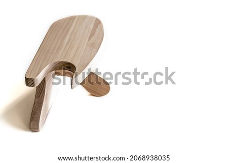 A wooden block made of beech for ironing with an iron. A tool for a tailor.