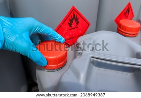 Open the lid of hazardous chemical tanks used in industry and laboratories Royalty-Free Stock Photo #2068949387