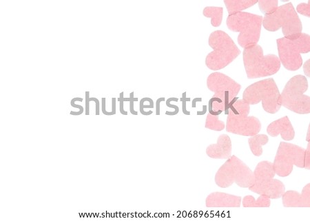 The background of covered with pink hearts.
