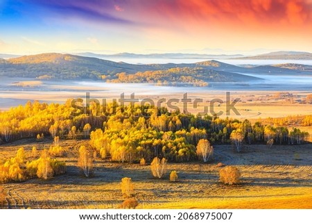 Colorful forest and mountain natural landscape in autumn.Beautiful autumn scenery in the Ulan Butong grassland,Inner Mongolia,China. Royalty-Free Stock Photo #2068975007