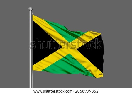 Jamaica flying flag on a black background for designer