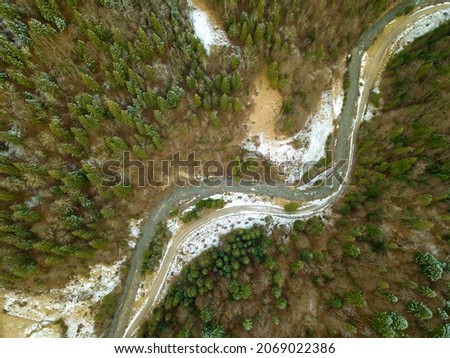 River and Snow in the Spruce Forest. Aerial View