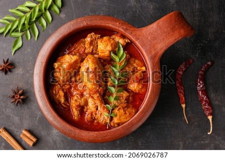 Spicy red chicken curry. Kerala style chicken vindaloo. Butter chicken Murgh Makhani curry Indian spices hot and spicy gravy dish Dhaba Punjab, India. North Indian non-veg cuisine Garam Masala. tikka Royalty-Free Stock Photo #2069026787