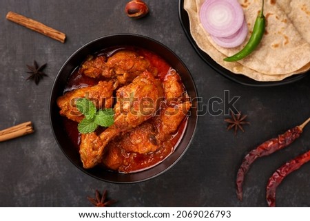 Spicy red chicken curry. Goan style chicken vindaloo. Butter chicken Murgh Makhani curry roast hot and spicy gravy dish Dhaba Punjab, India. North Indian non-vegetarian cuisine Garam Masala. tikka Royalty-Free Stock Photo #2069026793