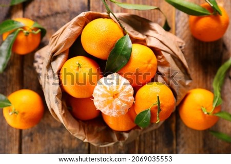 clementine- mandarin fruit and leaf background Royalty-Free Stock Photo #2069035553