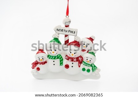 Christmas gift representing family on white background. Ornament. Snowman Family. 