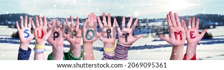 Children Hands Building Word Support Me, Snowy Winter Background