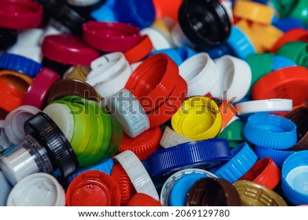 Close up of coloured plastic bottle caps.