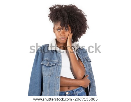pretty african woman posing on a white background, portraits