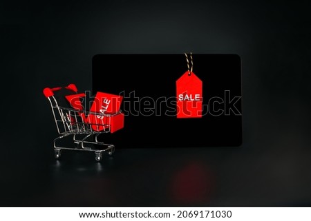 Banner, poster.Black Friday sale concept. Flat lay, top view, overhead.Black Friday shopping sale concept with red ticket Sale tag close up on black background.copy space. black friday concept.