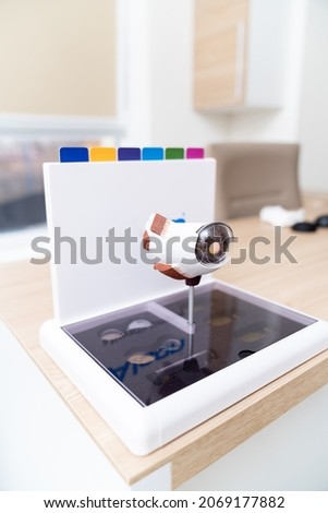 Ophthalmology lens for glasses in optometrist`s cabinet at the table. Laboratory for producing glasses