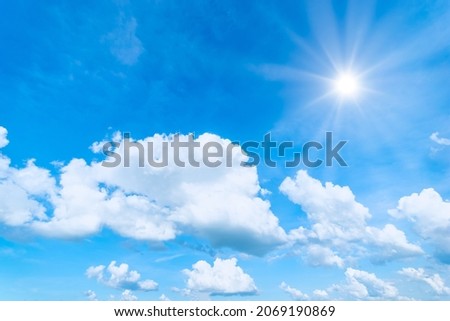 Blue sky background with the sun,Blue sky with white clouds floating in the sky.