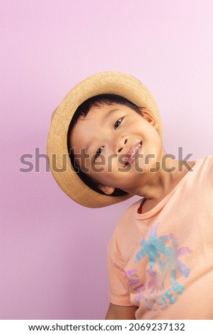 Close-up portrait of asian child boy he nice-looking creating new idea solution fantasize copy space isolated pink color background