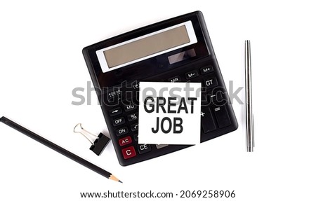 GREAT JOB text on sticker on the calculator with pen,pencil on white background