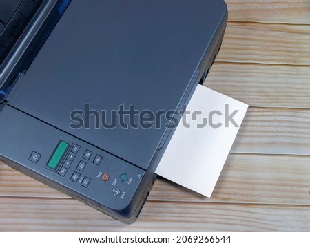 Domestic printer and paper at work area
