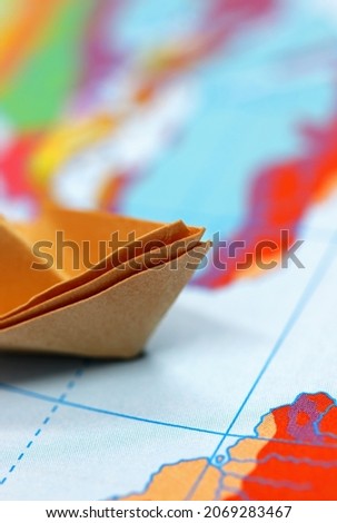paper boat on the map
