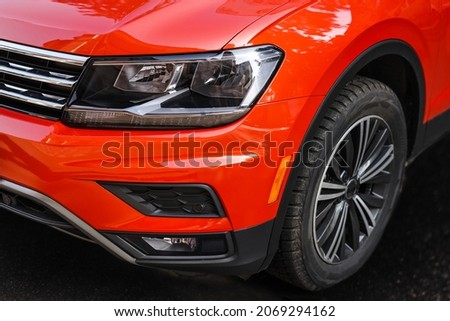 headlight of a super car of red color close-up. modern sports car details. car front light Royalty-Free Stock Photo #2069294162