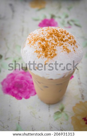 Ice cappuccino coffee with vintage background