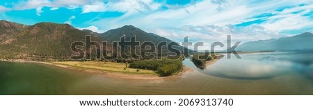 Aerial Panoramic View of a beautiful lake in Canadian Nature Landscape. East Kootenay, British Columbia, Canada. Royalty-Free Stock Photo #2069313740