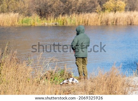 Fishing on the river, autumn nature.
