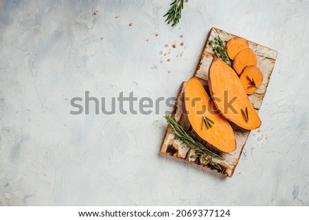 Raw sweet potatoes or batatas on light background. banner, menu, recipe place for text, top view.