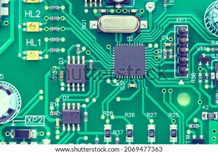 High-tech board with electronic components and microchips close-up