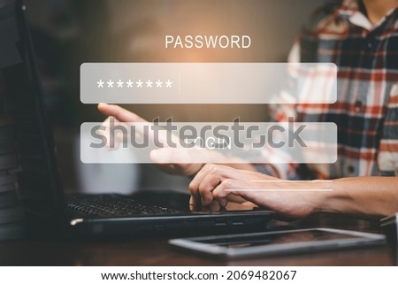 Security password login online concept  Hands typing and entering username and password of social media, log in with smartphone to an online bank account, data protection from hacker Royalty-Free Stock Photo #2069482067