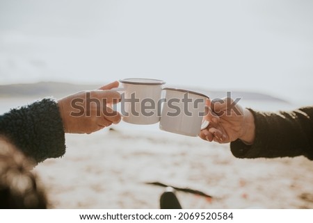 Camping couple having coffee in the morning