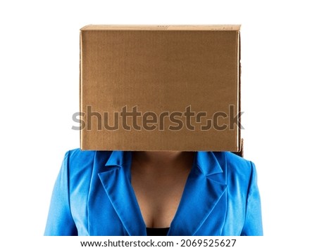 business woman hides under a box. isolated on white background Royalty-Free Stock Photo #2069525627