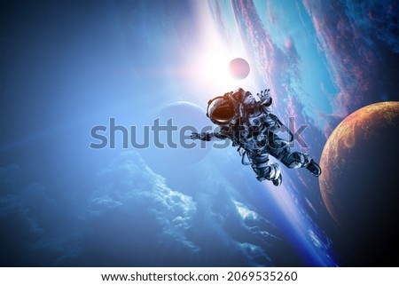 Astronaut at spacewalk . Mixed media Royalty-Free Stock Photo #2069535260