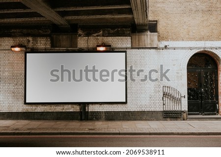 Blank billboard on a white wall Royalty-Free Stock Photo #2069538911
