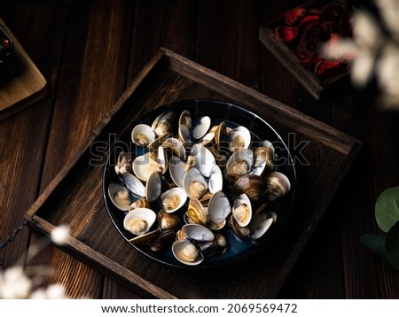 Steamed Clams with Rice Wine. Royalty-Free Stock Photo #2069569472