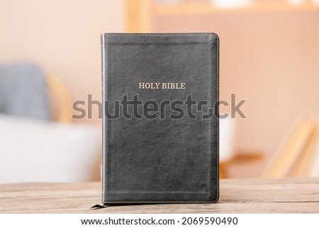 Black Holy Bible on table in room