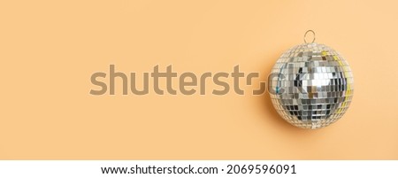 Disco ball on camel background isolated. Horizontal creative poster, greeting cards, headers, website
