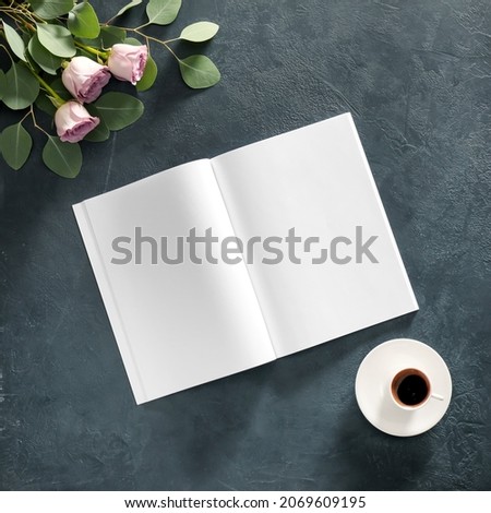 Blank magazine, coffee and flowers on grey background