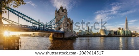 Panorama of the Tower Bridge and cityscape of London during sunrise