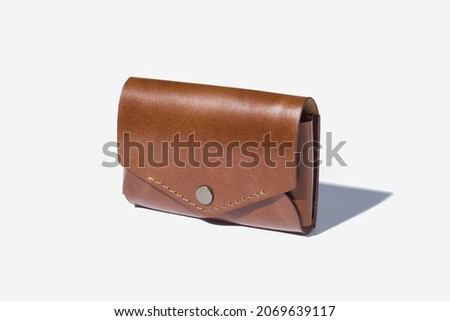 Leather business card holder from handmade on a white isolated background