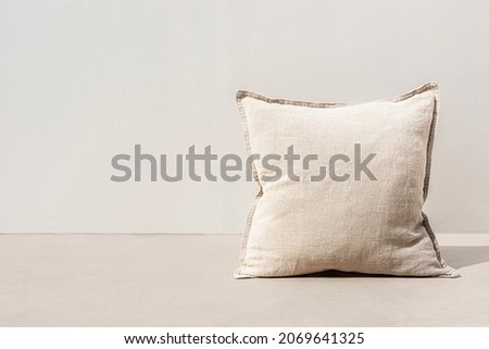 Minimal beige printed cushion on interior design Royalty-Free Stock Photo #2069641325
