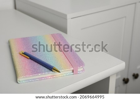 Bright planner and pen on white table indoors, space for text