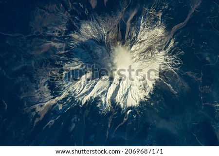 Snowcapped mountain in North America. Digital Enhancement. Elements of this image furnished by NASA. Royalty-Free Stock Photo #2069687171