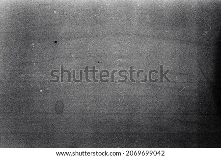 Blank grained film strip texture background with heavy grain and dust