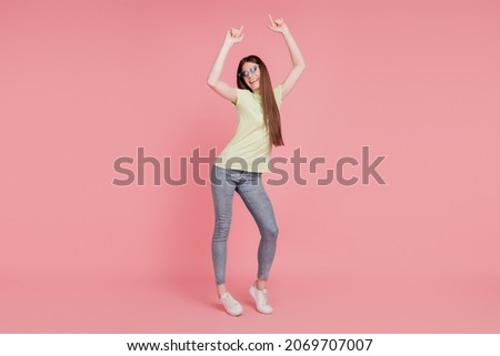 Full lenght photo of her she nice-looking attractive lovely pretty cheerful girl dancing having fun isolated over pink color background