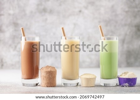 Various Protein sport shake and powder. Fitness food and drink. Royalty-Free Stock Photo #2069742497