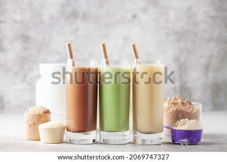 Various Protein sport shake and powder. Fitness food and drink. Royalty-Free Stock Photo #2069747327