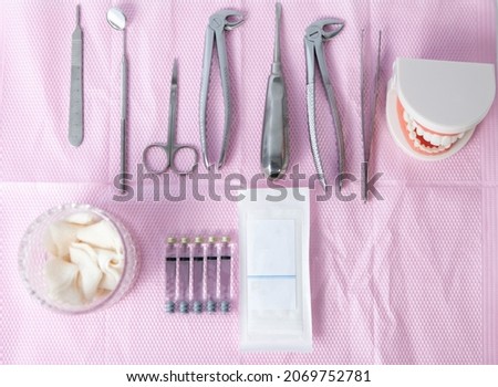 Dental surgical equipments with human jaw model. Flat lay. Top view