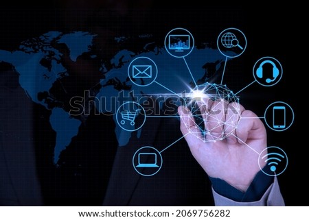 Digital marketing, Global business, IoT Internet of Things, business strategy concept. Businessman touching on global network with technology icons. High quality photo