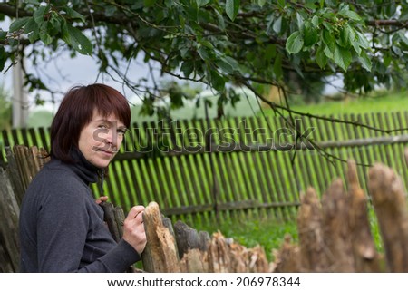 Unusual middle aged woman portrait by old wooden fence
Naturally lit shot with copy space on right