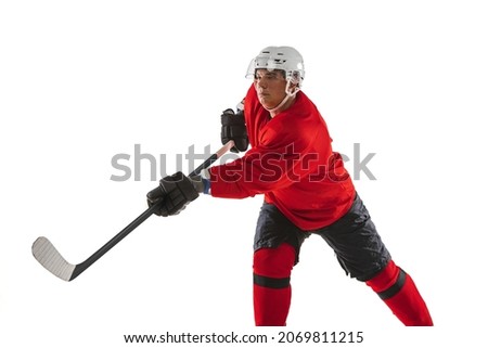 Hitting plug. Professional male hockey player training isolated over white background. Championship, competition, team game. High concentration. Concept of action, team sport game, energy, ad