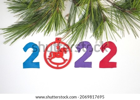 Plasticine New Year card for 2022. Children's creativity concept